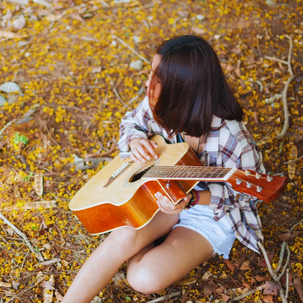 Leveraging A&R teams for music discovery can start with raw, acoustic performances like this guitarist playing outdoors in nature.