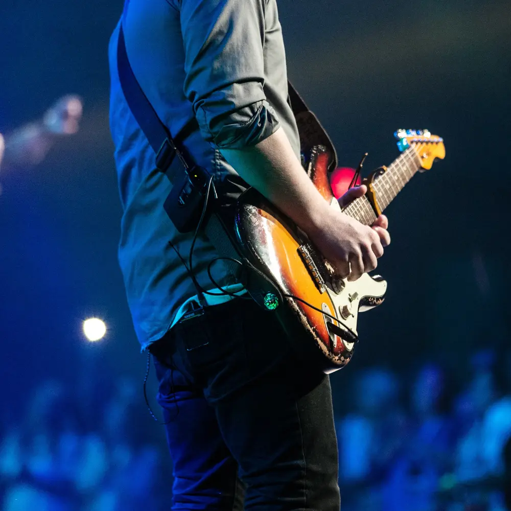 Social media for music artists amplified by a guitarist performing live on stage